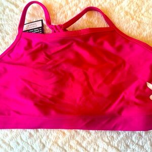 NWT.  Onzie pink sports bra with Playboy logo.  Size Large but seems smaller.